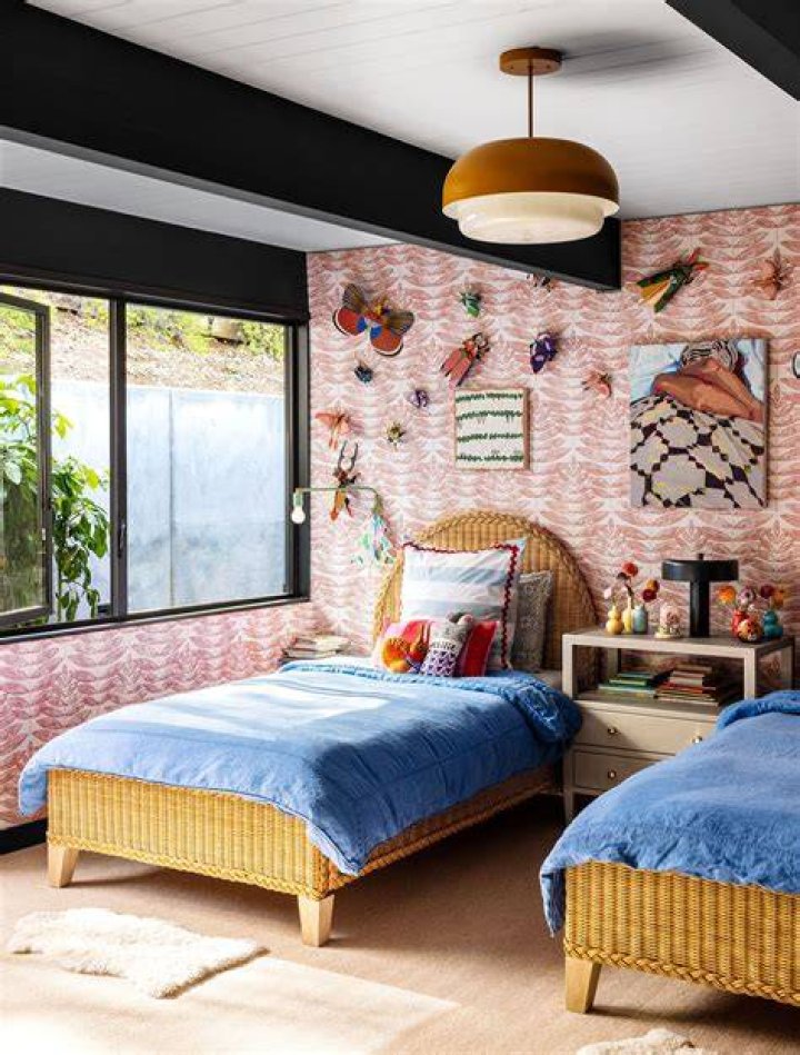 The kids bedroom has a vibrant colour scheme and oval windows