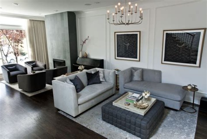 The living area includes two sofas and a televison