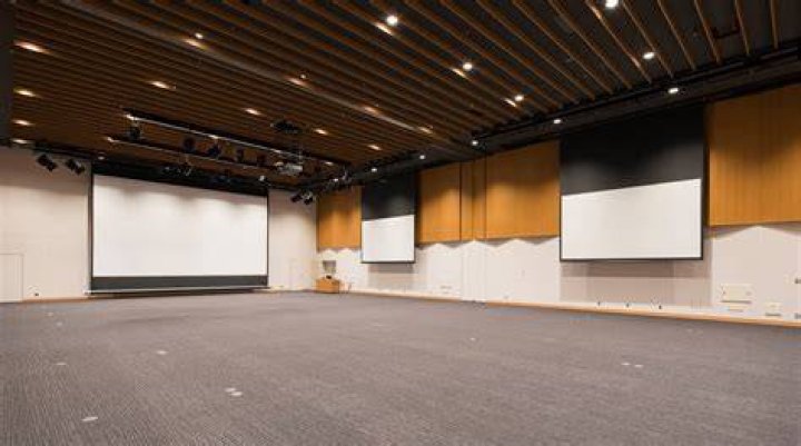 The main hall is equipped with 30-foot ceilings and a fireplace