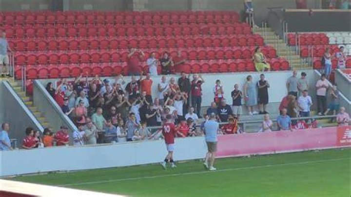  The main stand after its renovation, and the outside bar that has proved a massive hit with fans