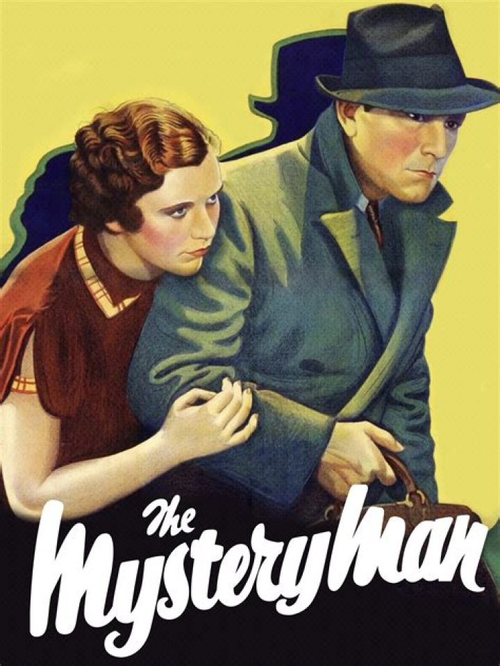 The mystery man prods the bug with a big silver blade
