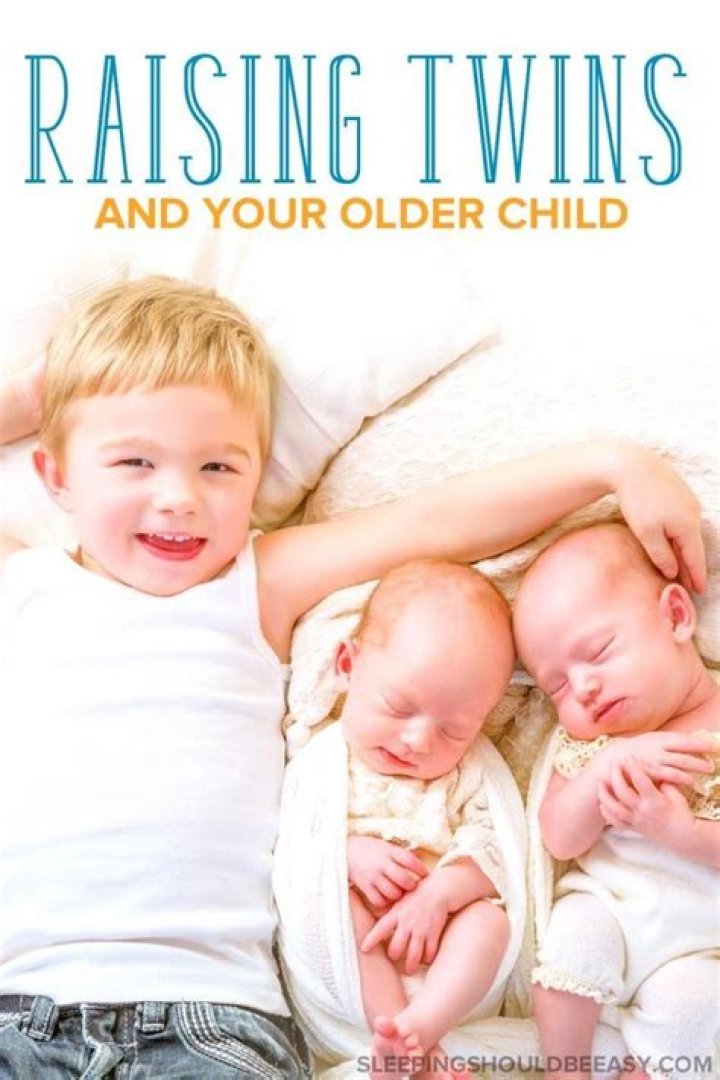 The newborn already has two very excited sisters