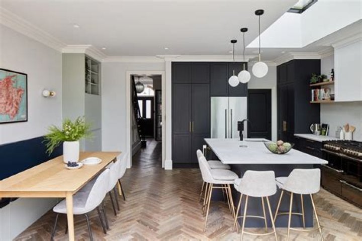 The open plan kitchen is fully kitted out with appliances