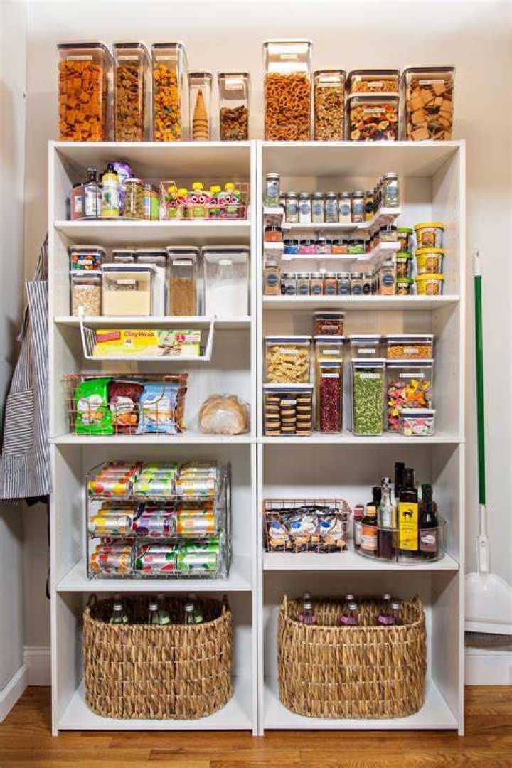  The pantry was organized to perfection with clear jar and glass canisters