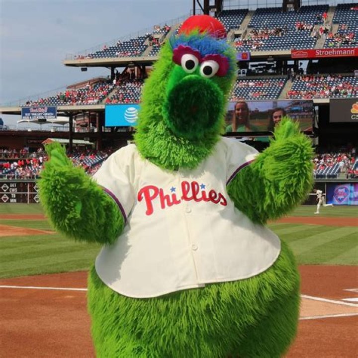 The Philadelphia Phillies mascot the Phillie Phanatic rides a Hatfield Hot Dog cart in the outfield during the game in Philadelphia, Pennsylvania.