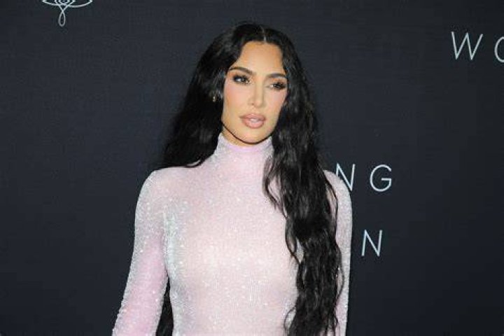 The photo showed off Kim's shrinking butt as she wore a black dress