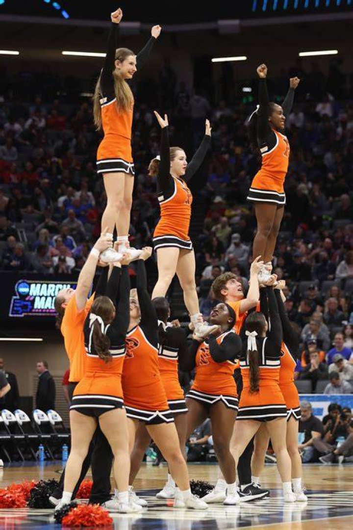 The Princeton University cheerleaders performing at the game between the Princeton Tigers and the Arizona Wildcats in Sacramento, California, on March 16, 2023