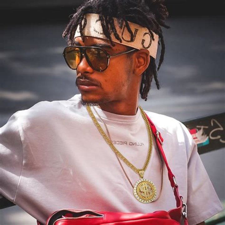 The rapper, 44, wore gold necklaces bearing the names of his four children