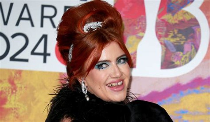 The singer flashed a cheeky side boob in this cream look