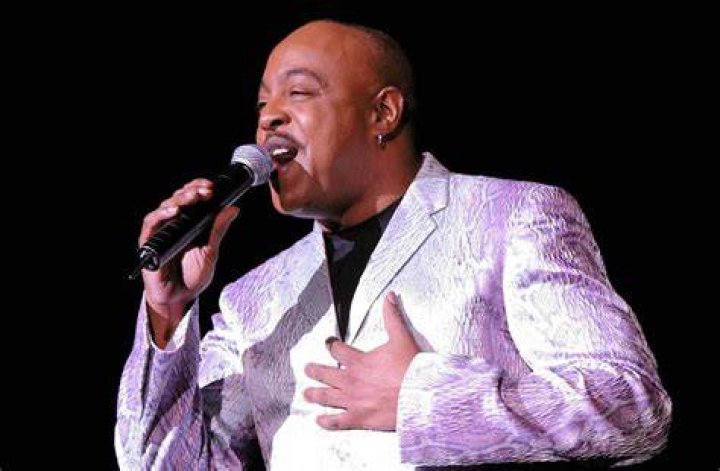 The singer had his arms full leaving his Jeep