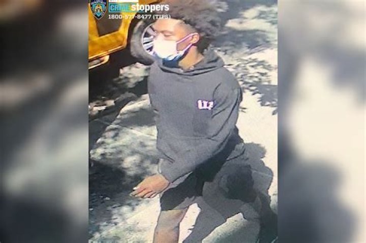  The suspect, wearing a black hoodie, runs off with his bag of money