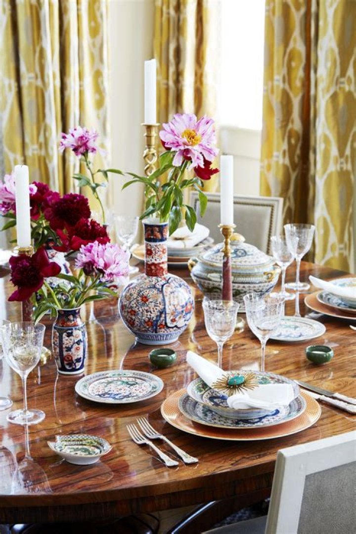 The table was decorated with vases filled with yellow roses, lemon-motif napkins, and fruit-print plates