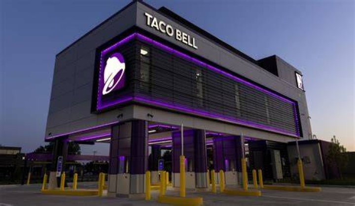 The Taco Bell Defy prototype location features a two-story structure with four drive-thru lanes