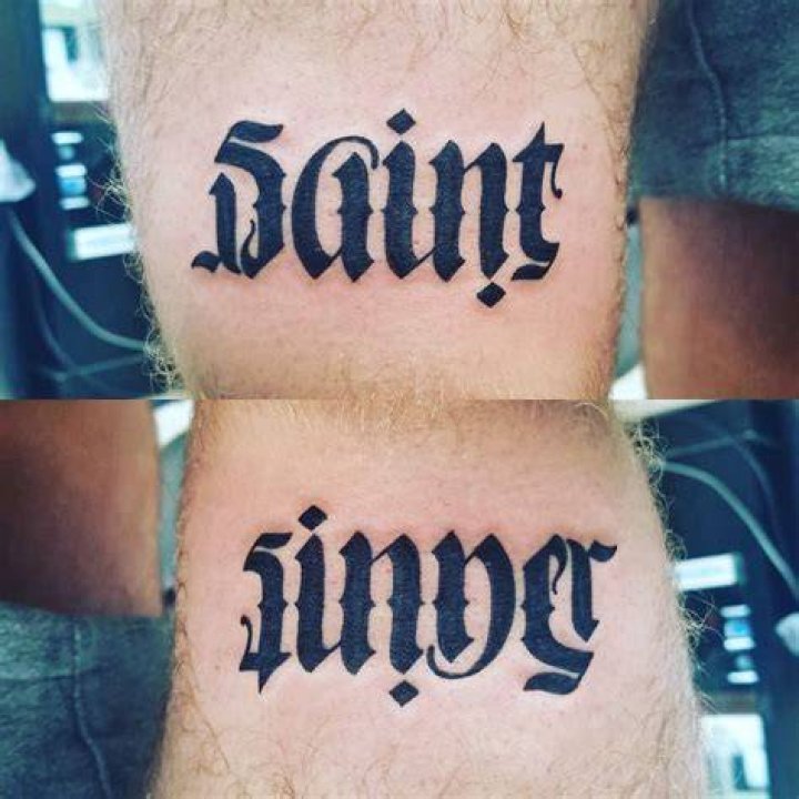 The tattoo reads: 'A light from the shadows [shall spring]'