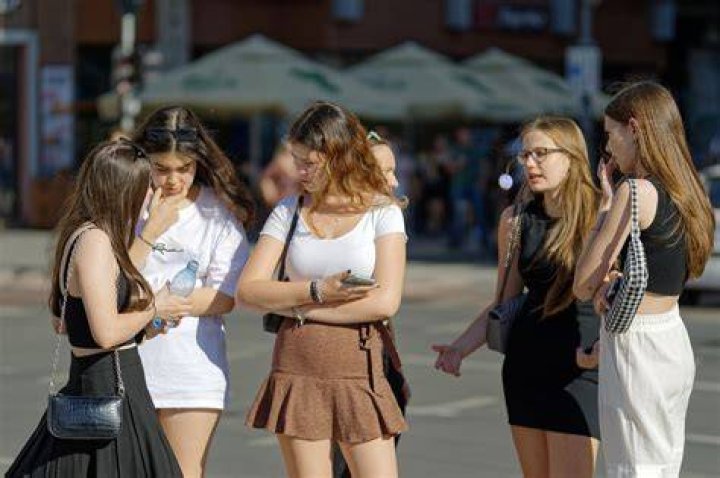  The teenager witnessed girls dressed in costumes "raising their skirts" to then-Italian PM Berlusconi, pictured