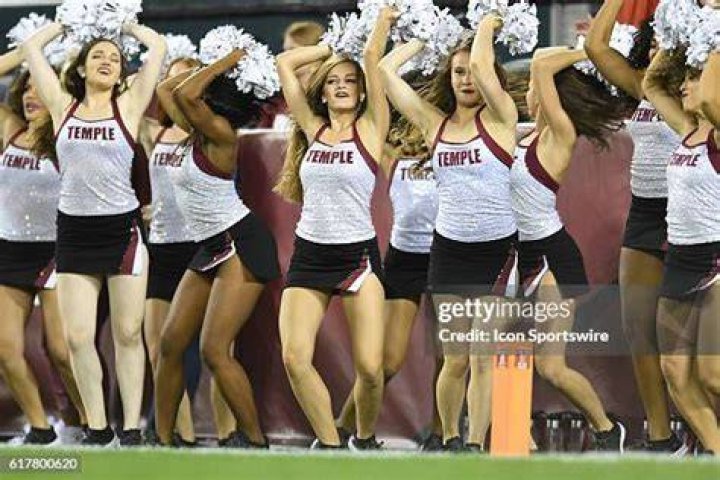  The Temple Owls cheerleaders perform a stunt during the first half at the Liacouras Center in 2018 in Philadelphia