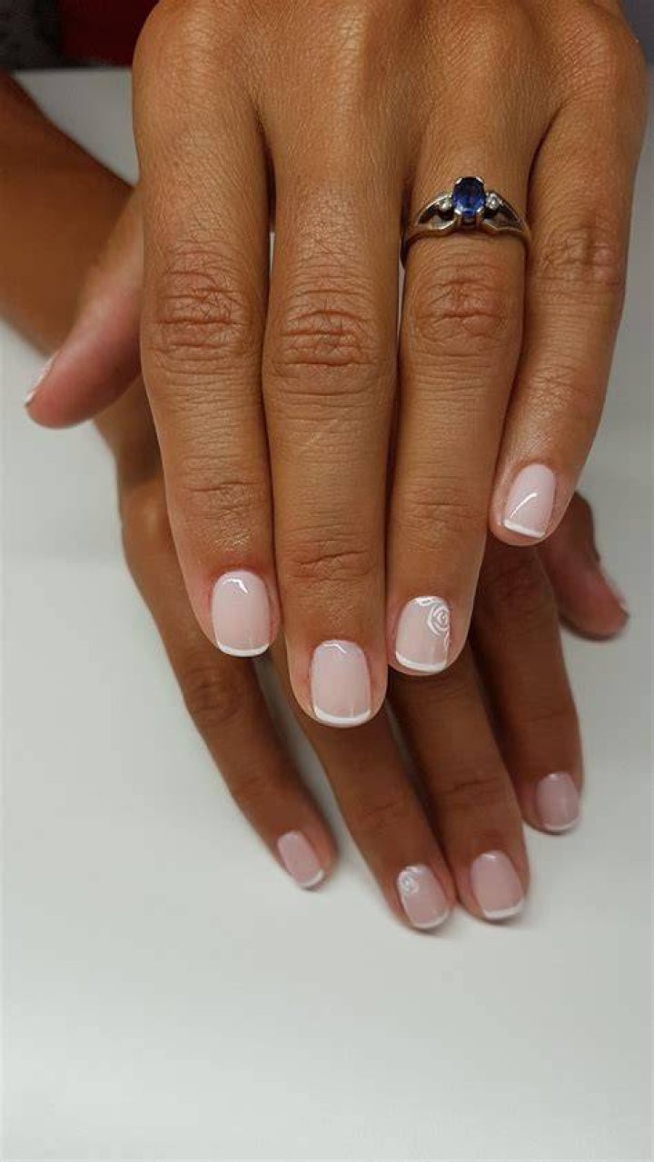 The tips of her nails were covered in what looked like clear droplets of water