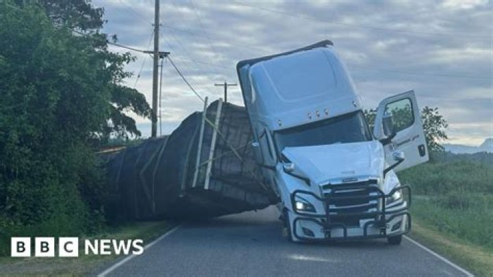 The truck reportedly overturned and blocked all traffic lanes