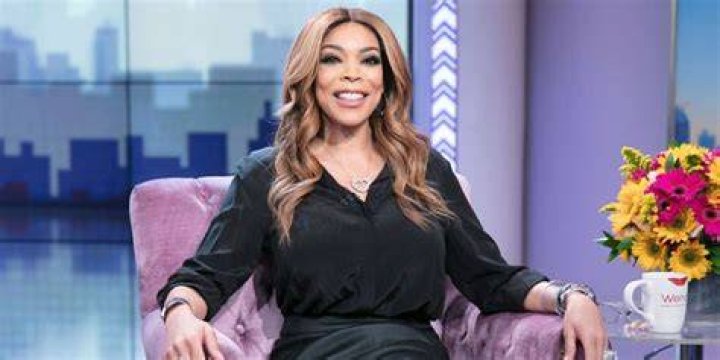 The Wendy Williams show host wore huge white fluffy boots on her stroll