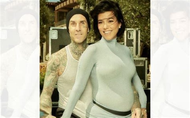 They were spotted behind Travis Barker in this photo