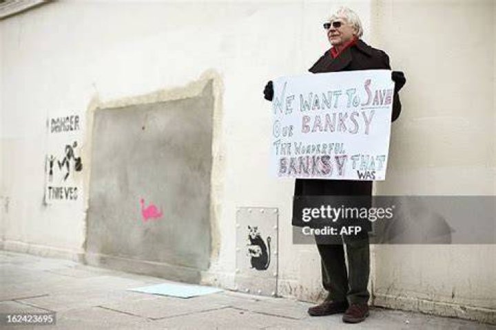 This Banksy placard was handed out in 2003 anti-war demonstrations to thousands of protestors