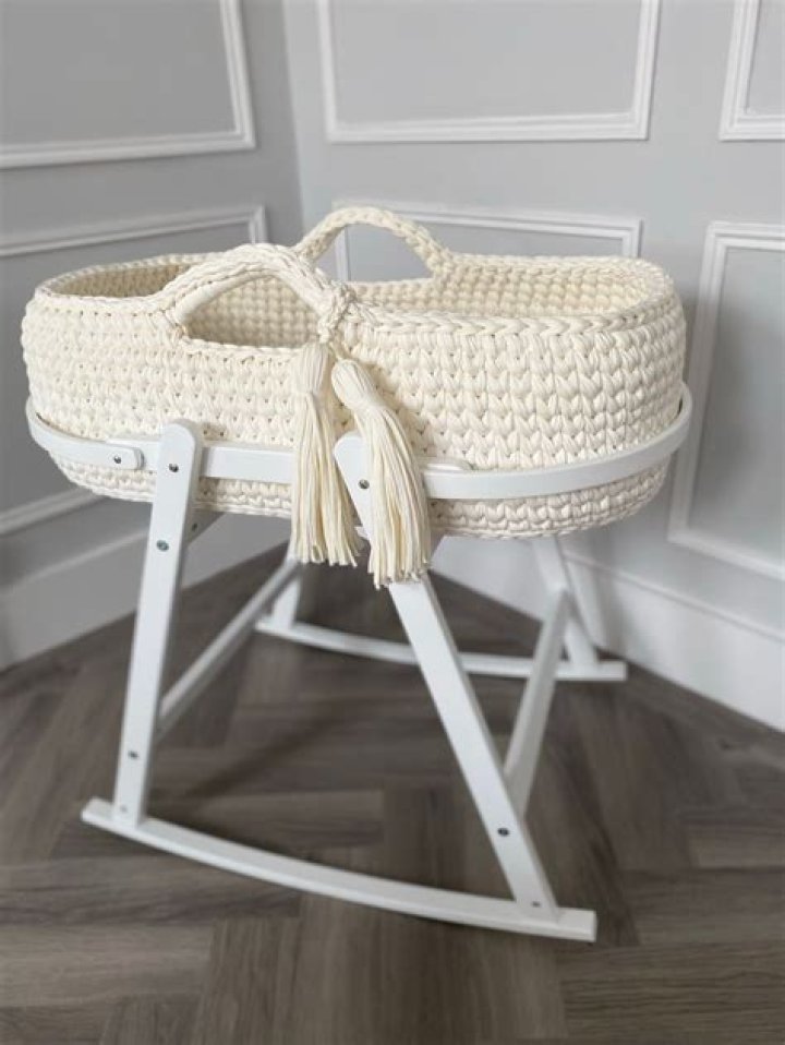 This beautiful knitted Moses basket includes a mattress as standard