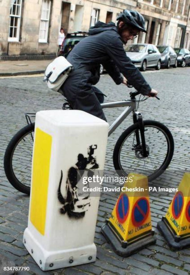 This bollard artwork is Banksy's depiction of paparazzi