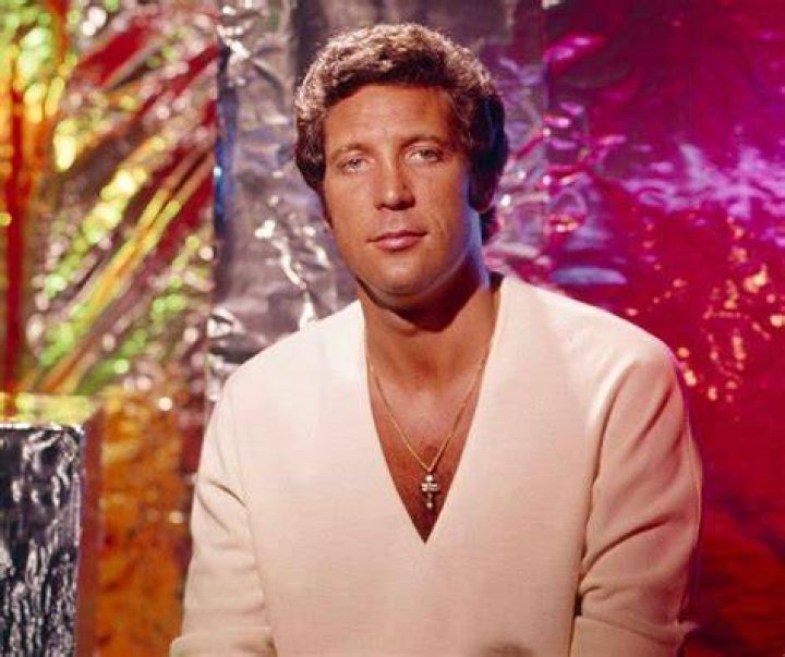 Tom Jones laughs as he's presented with a pair of knickers at Harrods alongside Mohamed Al-Fayed and former Miss UK Claire Smith