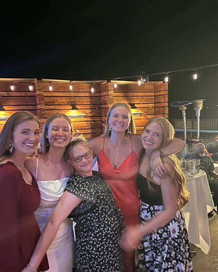 Truely dressed up in a black-and-white print gown for the big day, and was all smiles as she posed for photos with her sisters and extended family