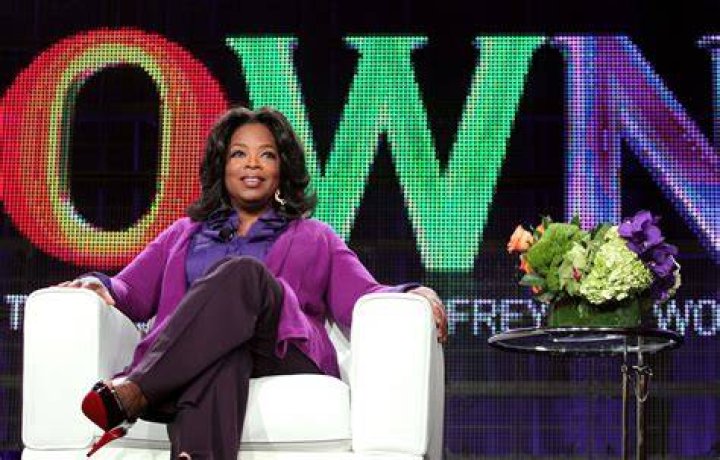 TV host Oprah Winfrey waves at Meghan and Harry's wedding