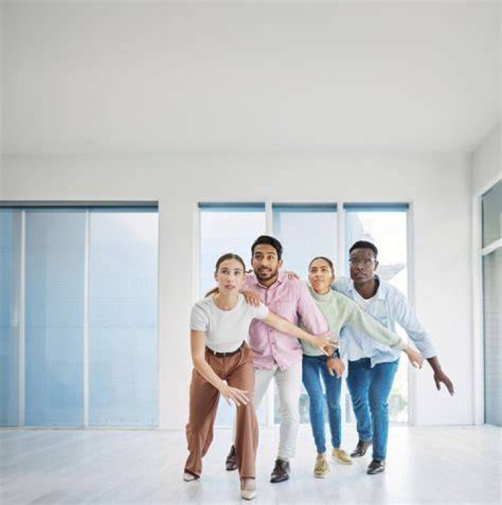 Two employees dance in the music video