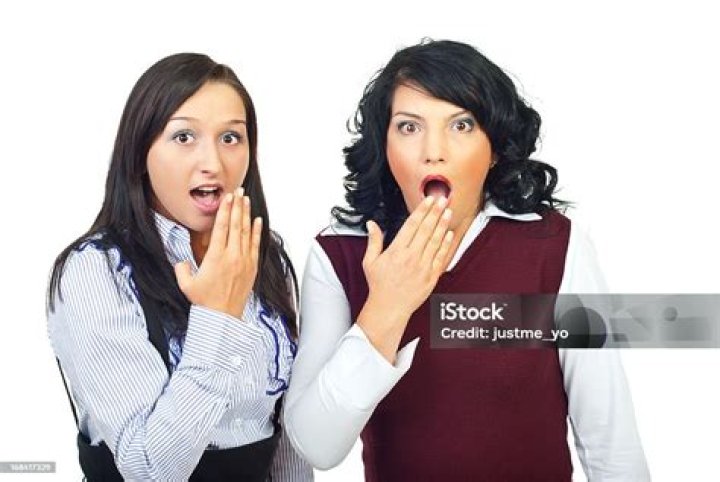  Two women scrap as shocked crowds gather to watch the violence
