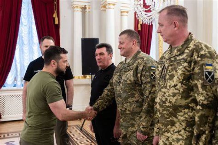 Ukraine intelligence officers inspect the Russian chopper which they say was stolen by Maxim Kuzminov