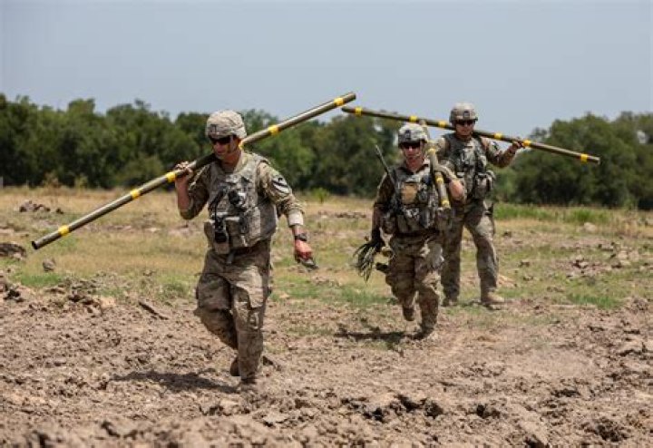  US combat engineers cross a swollen northern Rhineland stream