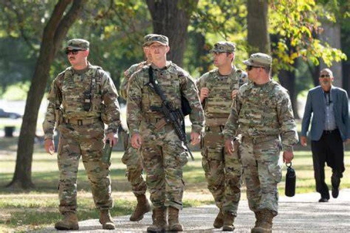 US National Guard troops patrol streets surrounding the Capitol