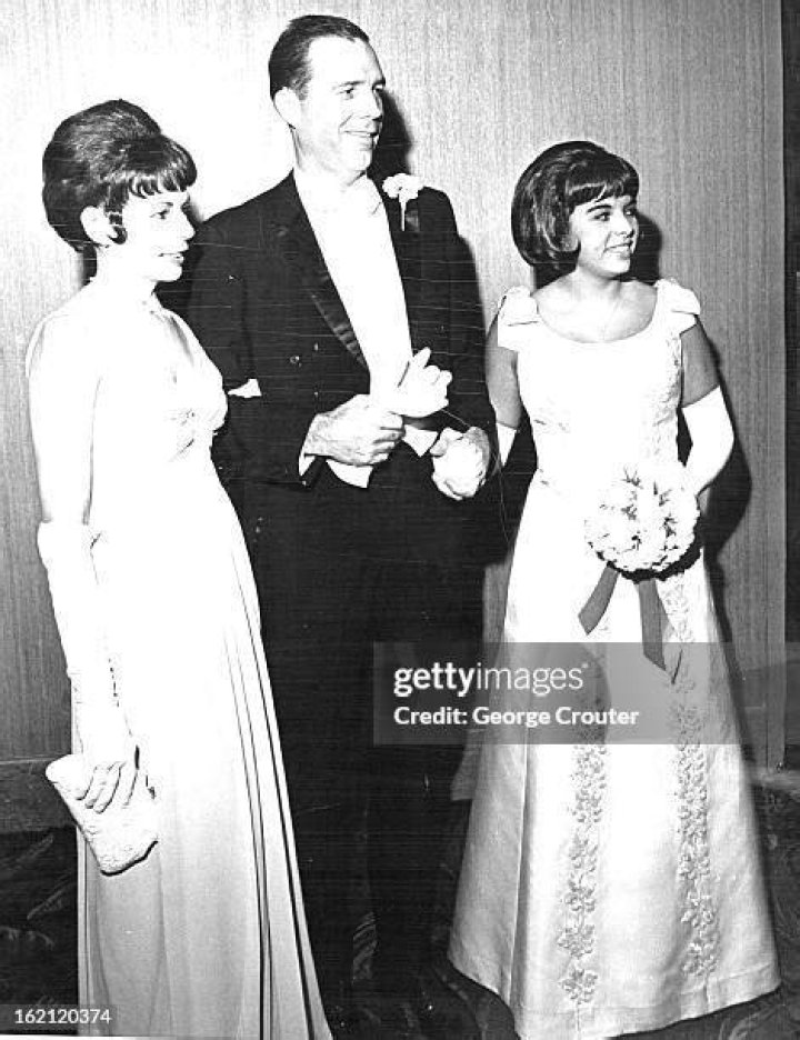 Voorhees posing with her parents